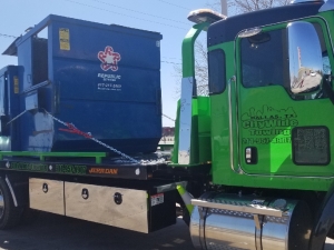 Towing a Dumpster for Maintenance